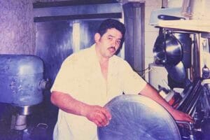 Frank Koxha holding pizza tray
