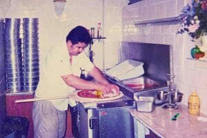 Photo about Frank Koxha a making pizza
