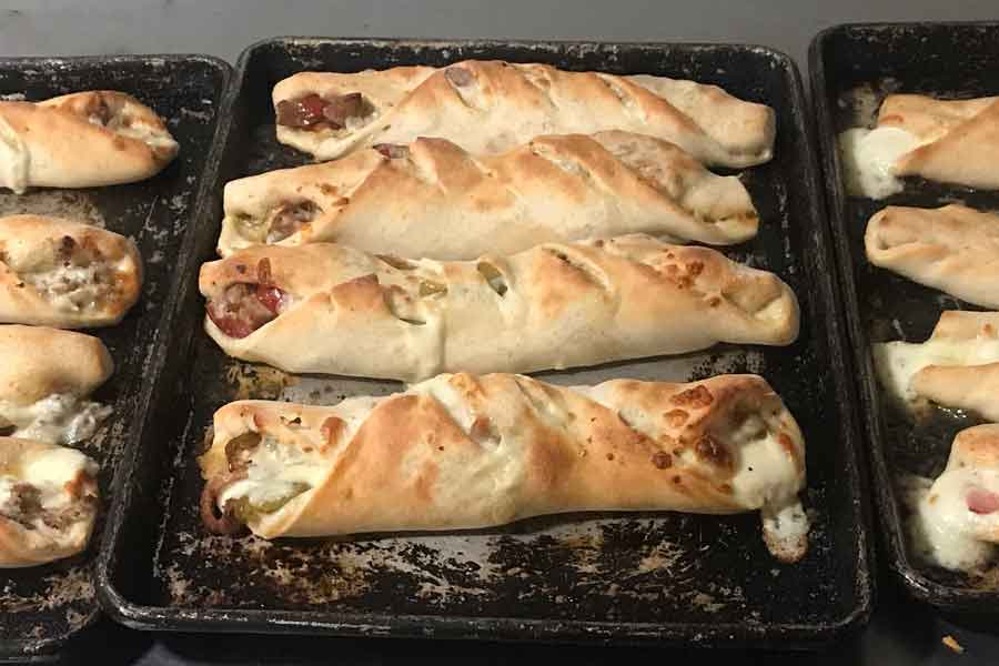 Ray's Stromboli filled with sausage pepperoni onions green peppers mushrooms and cheese